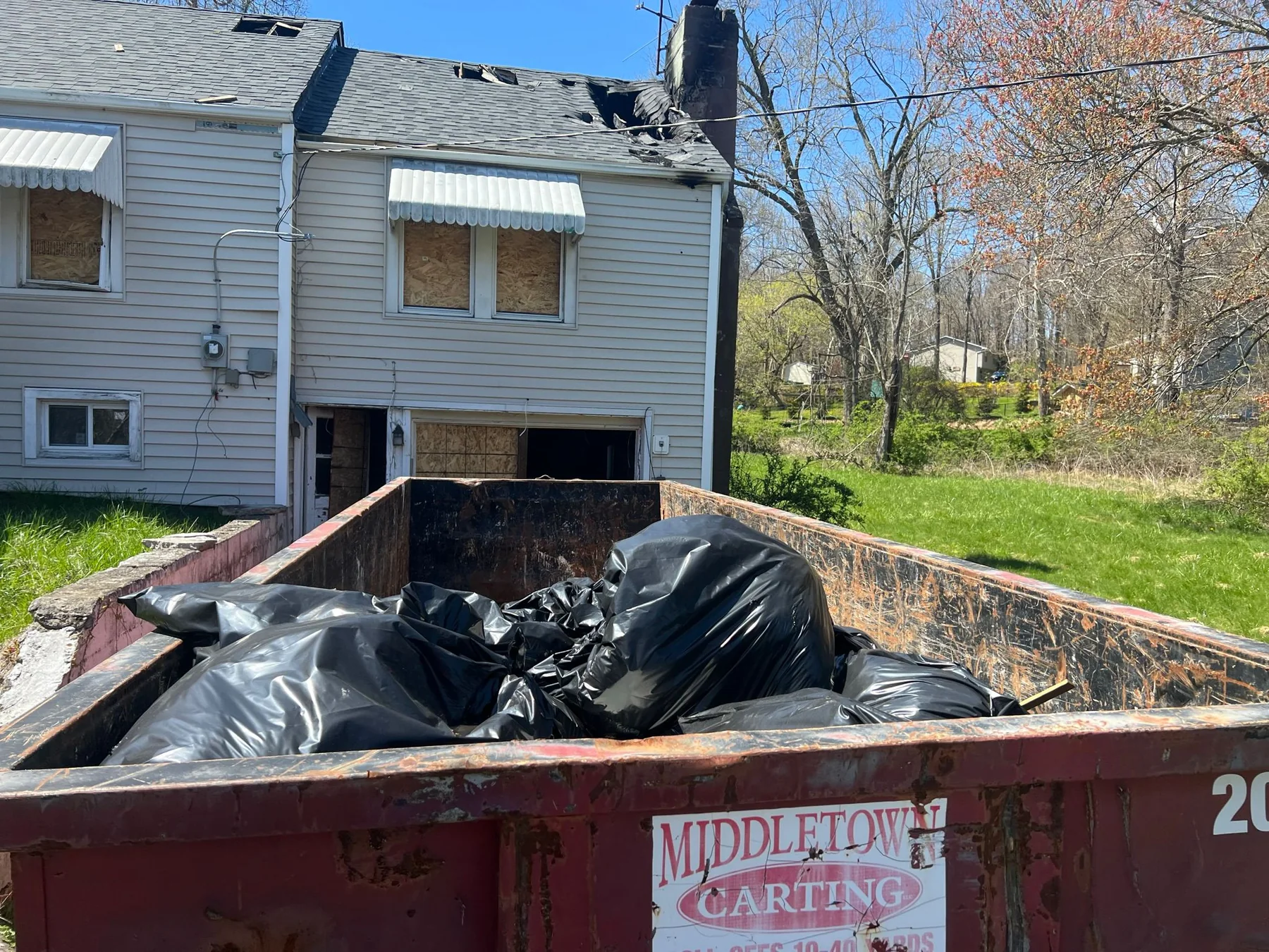 Exterior roof damage and demolition at 15 Riley Road