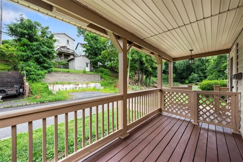 Covered front porch with railing
