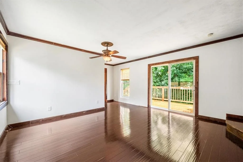 Finished living area with sliding door to rear deck