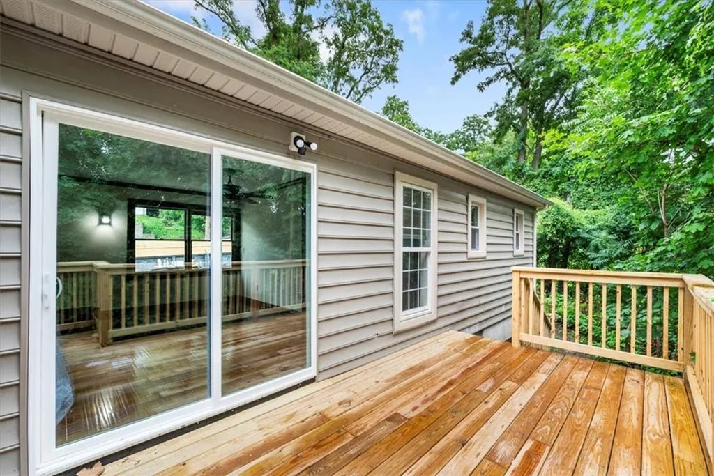 Rear deck with sliding glass door access