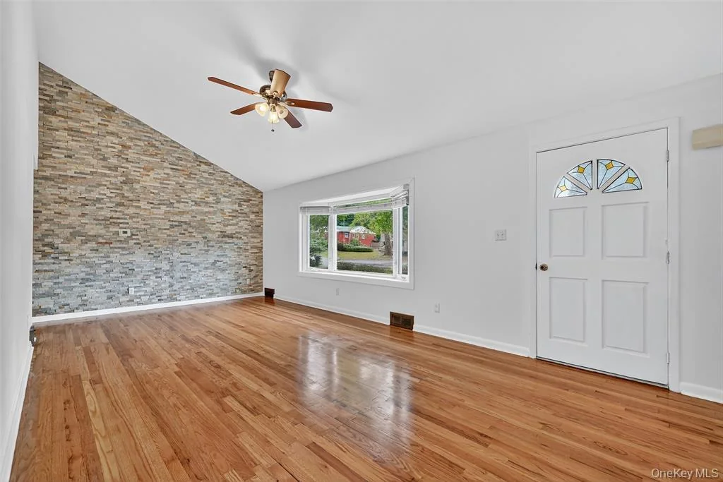 Completed living room with hardwood flooring