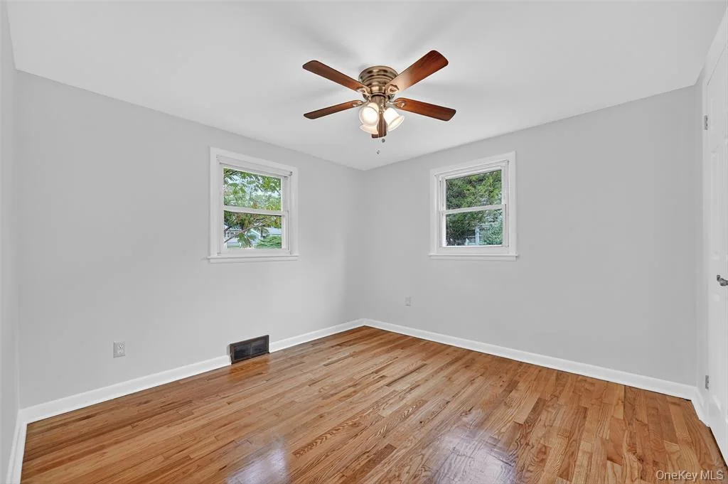 Completed bedroom with hardwood flooring