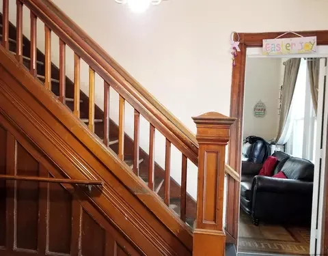 Original staircase and woodwork before the completed project presentation