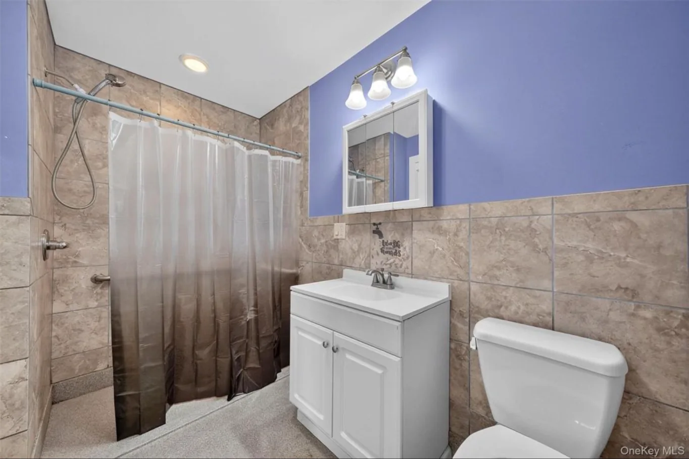 Completed first-floor bathroom shower and vanity