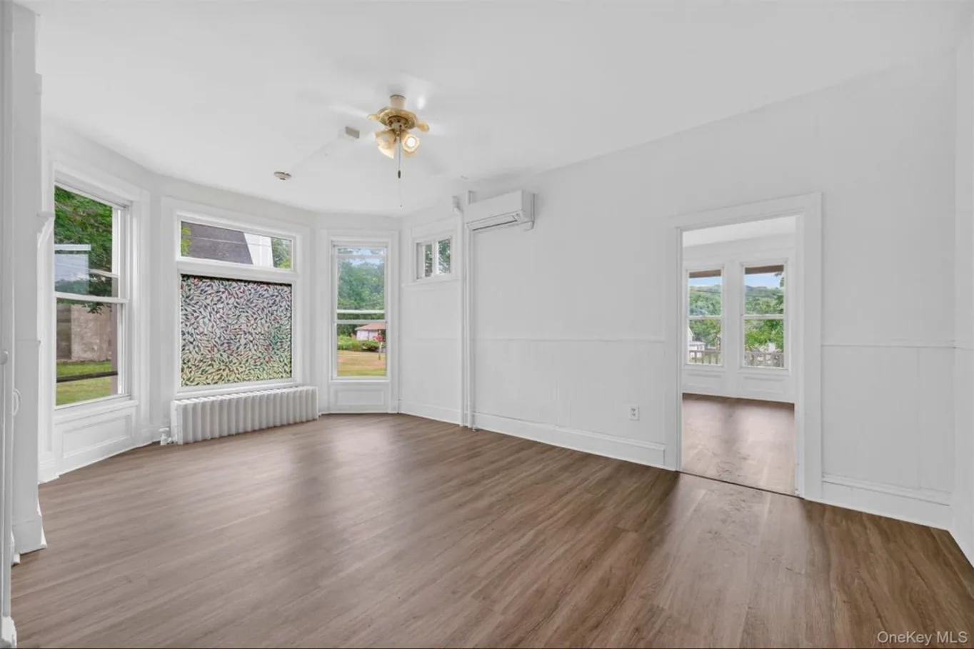 Completed first-floor front room with bay windows