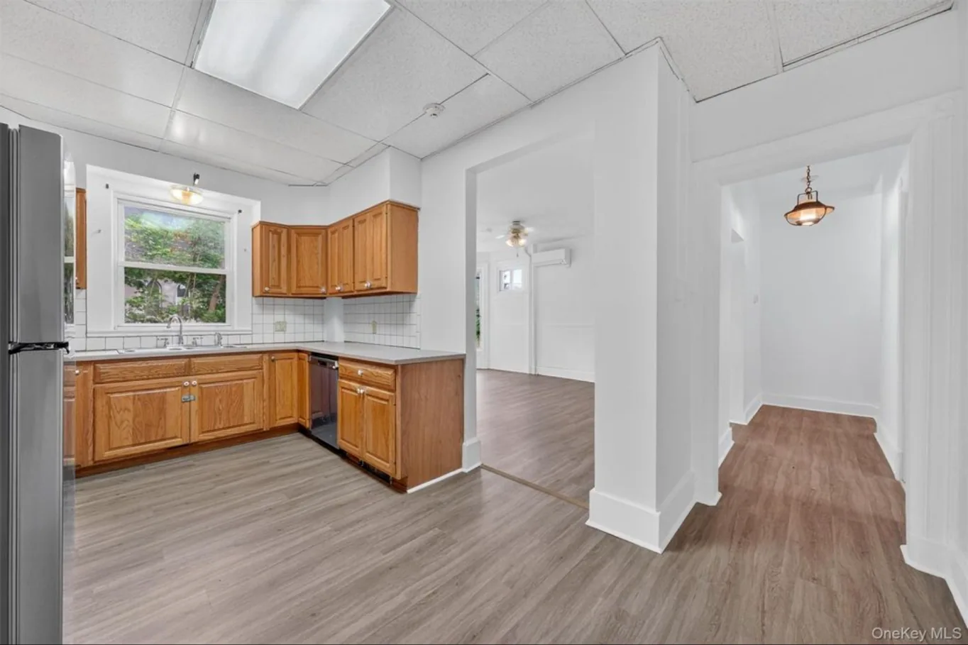 Completed first-floor kitchen opening to adjoining rooms