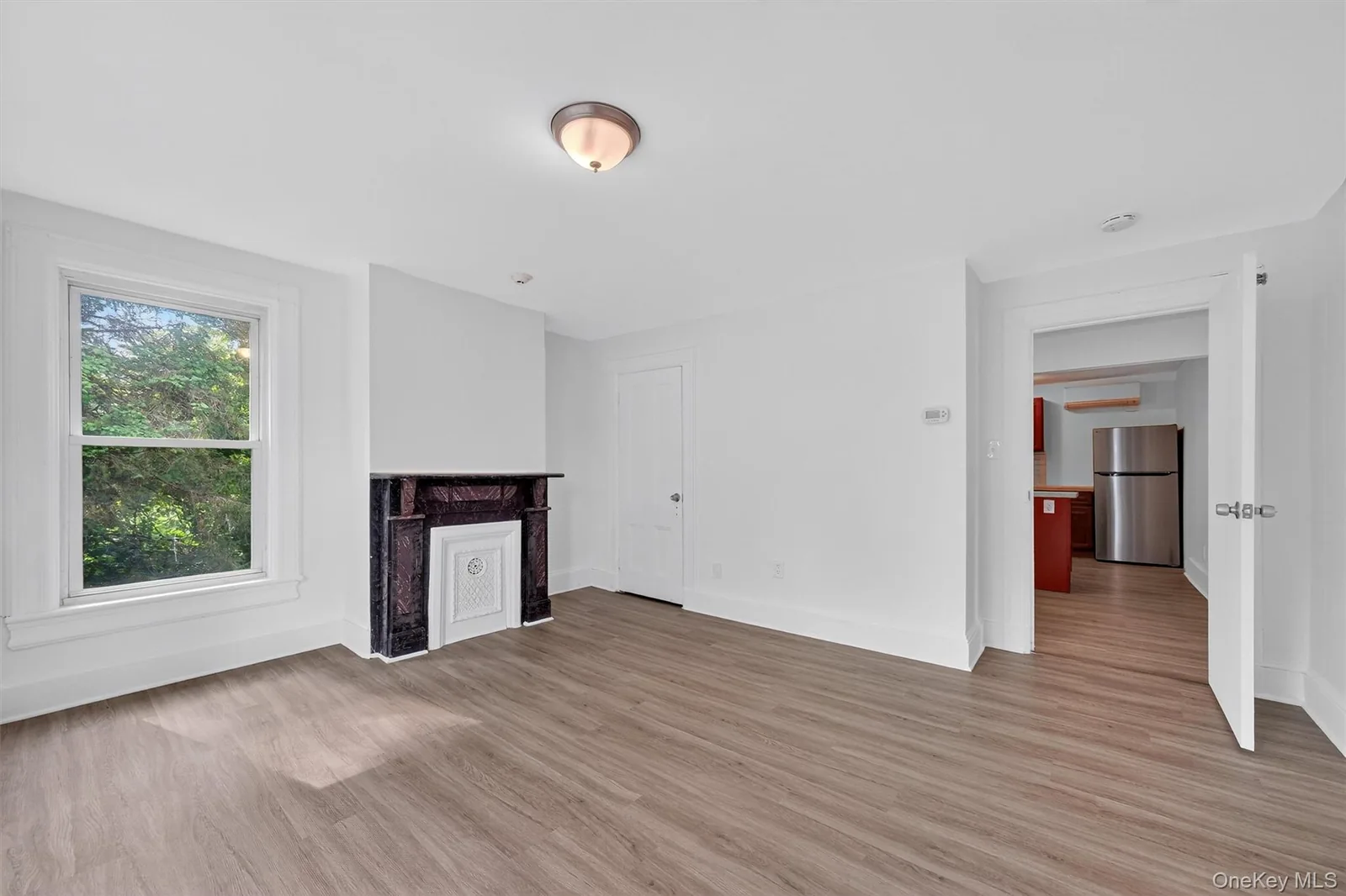 Completed second-floor room with decorative fireplace