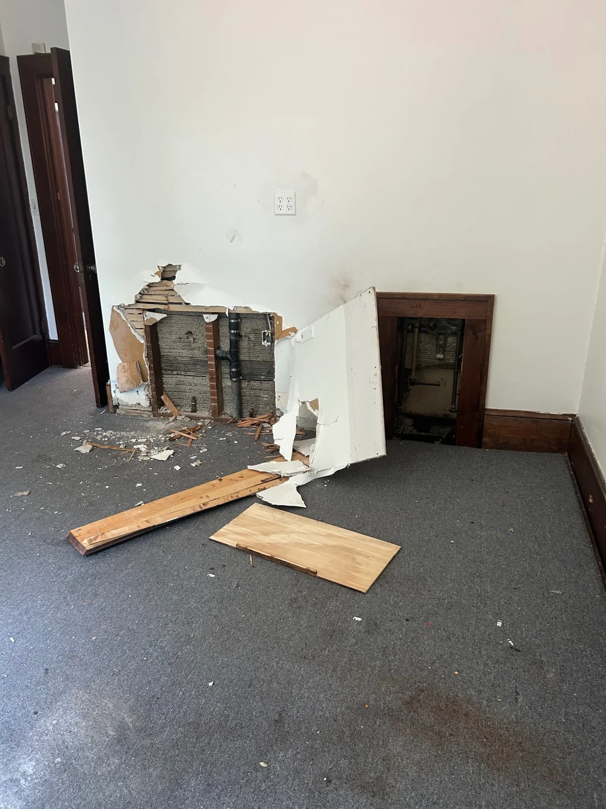 Opened interior wall with exposed services